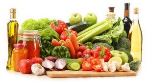 raw vegetables in wicker basket isolated on white